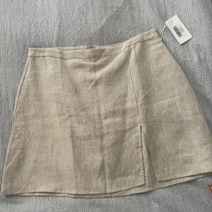 Reformation beige colored mini skirt